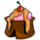 A chocolate Kau hoof filled with strawberry sundae, topped with orange sauce and a cherry.